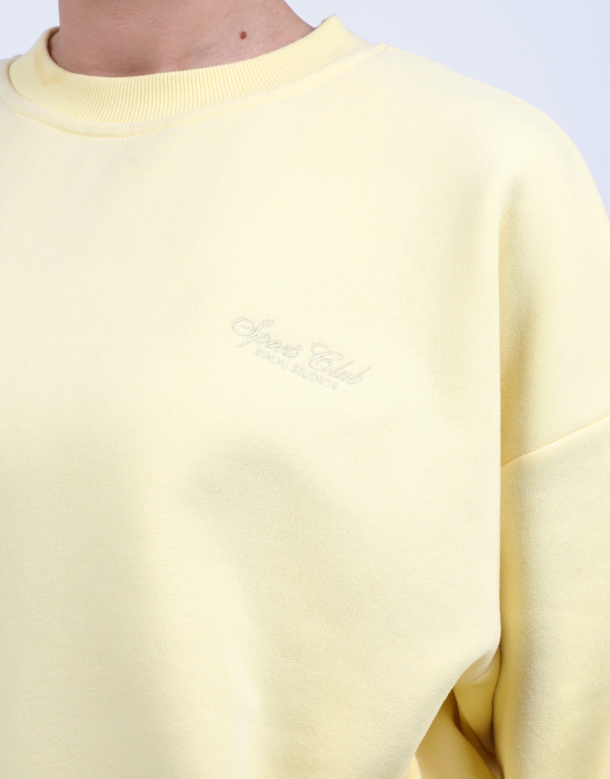 Rue Simmi Studios Embroidered Logo Sweatshirt In Yellow