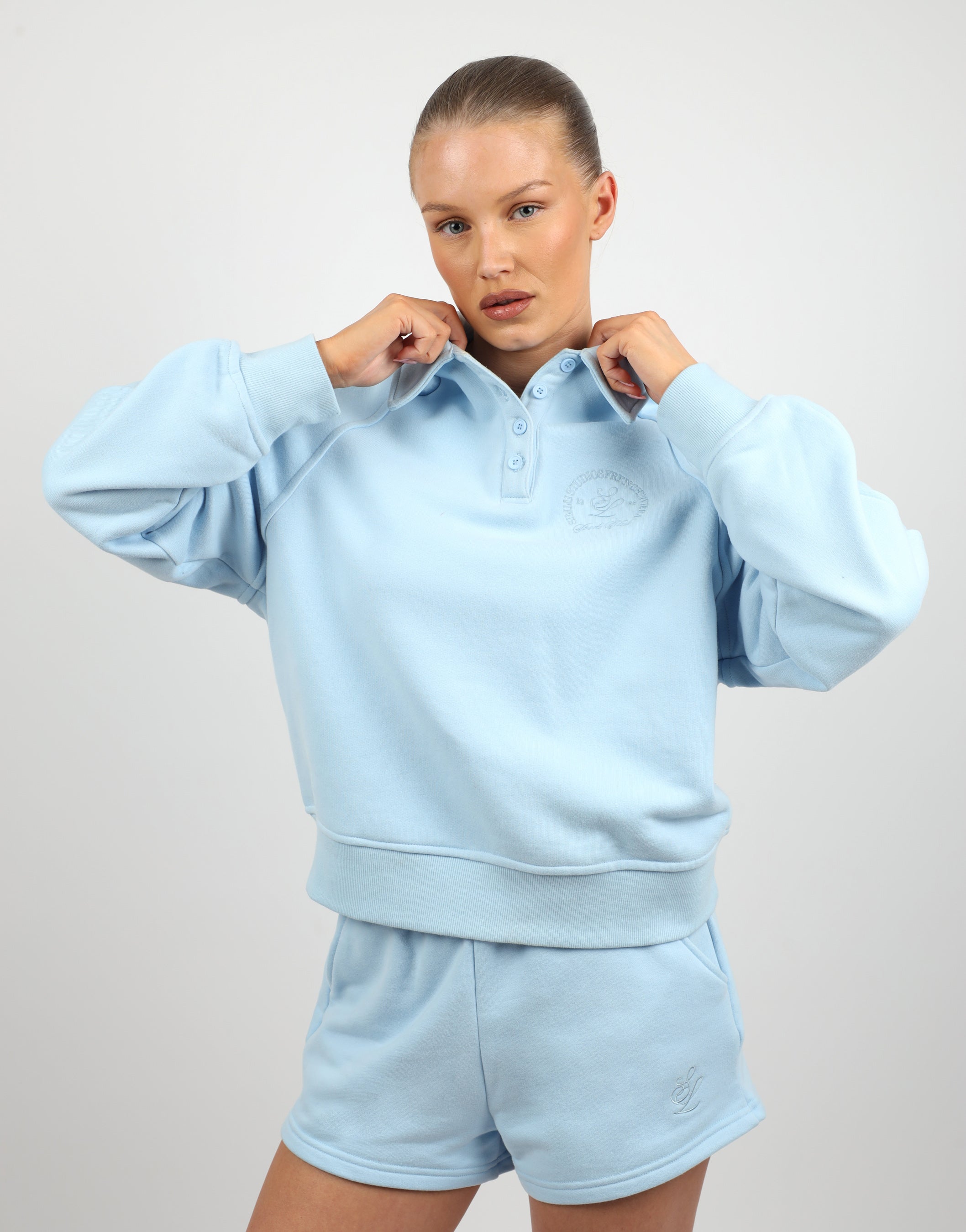Monaco Simmi Studios Embroidered Logo Polo Sweatshirt In Baby Blue