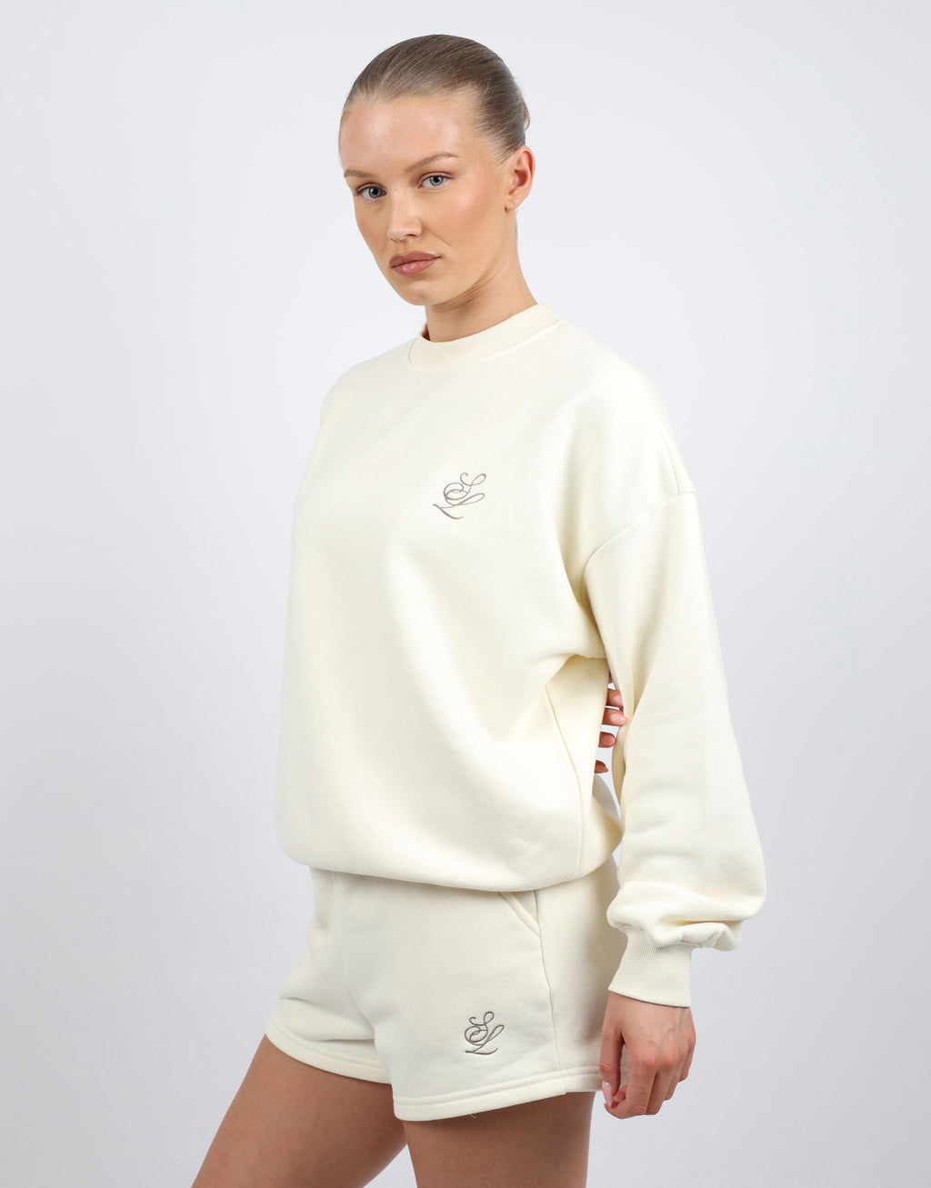 Cove Simmi Studios Embroidered Logo Sweatshirt In Cream