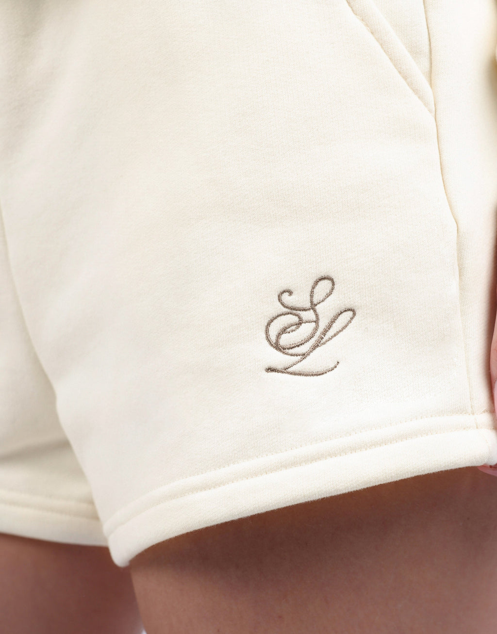 Riva Simmi Studios Embroidered Logo Shorts In Cream