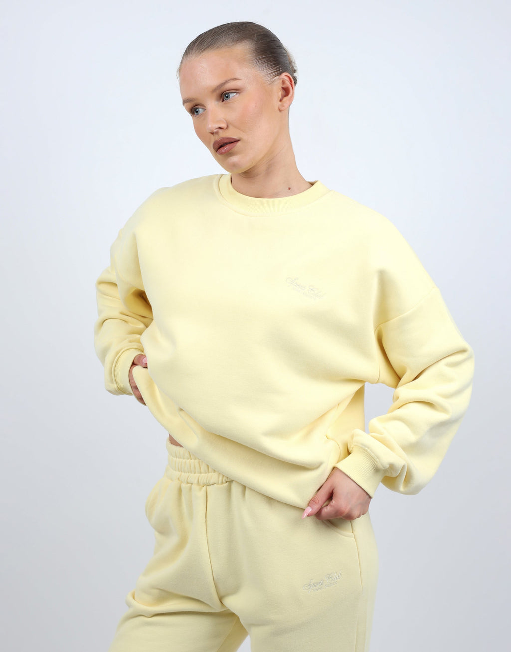 Rue Simmi Studios Embroidered Logo Sweatshirt In Yellow