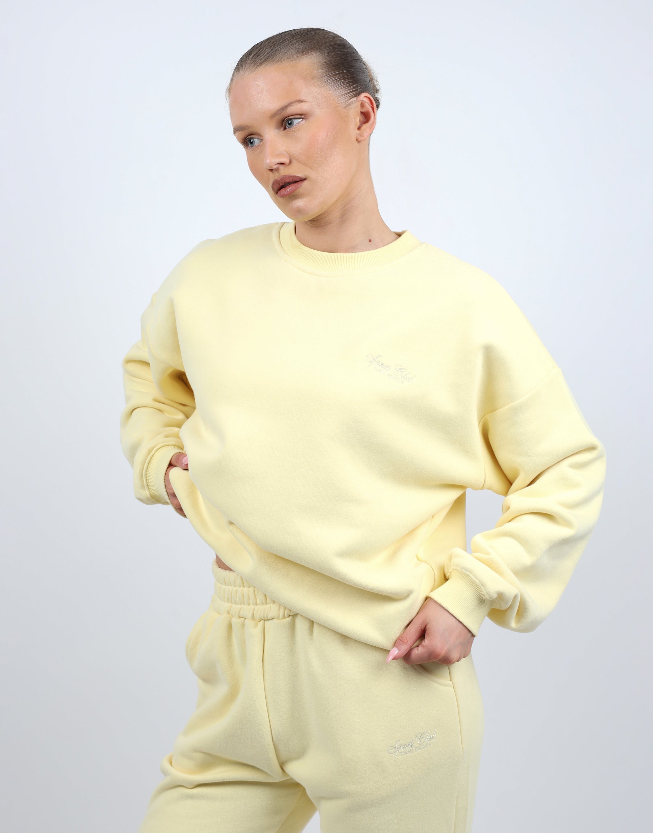 Rue Simmi Studios Embroidered Logo Sweatshirt In Yellow
