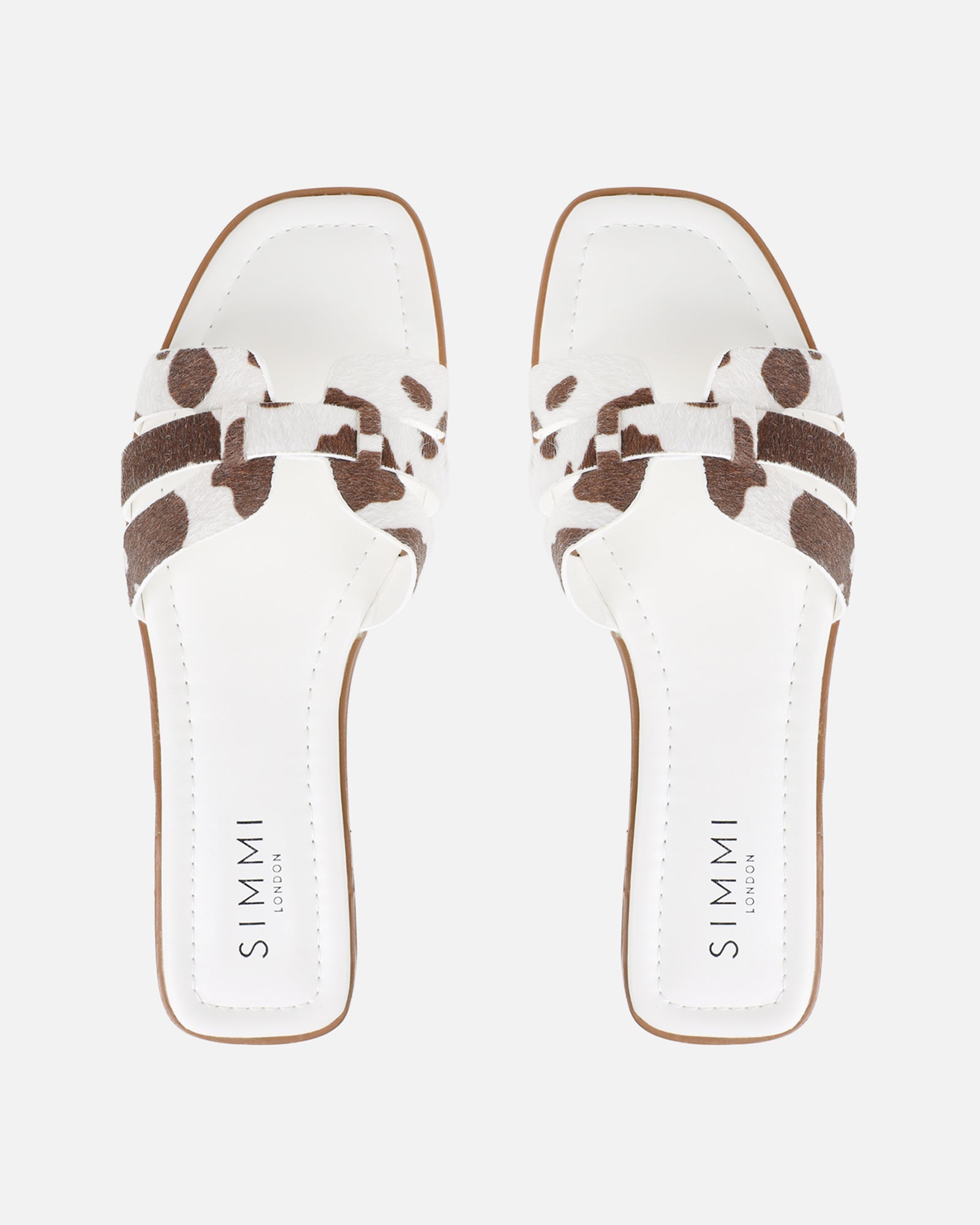 Jorja Cow Print Slip On Flat Sandals