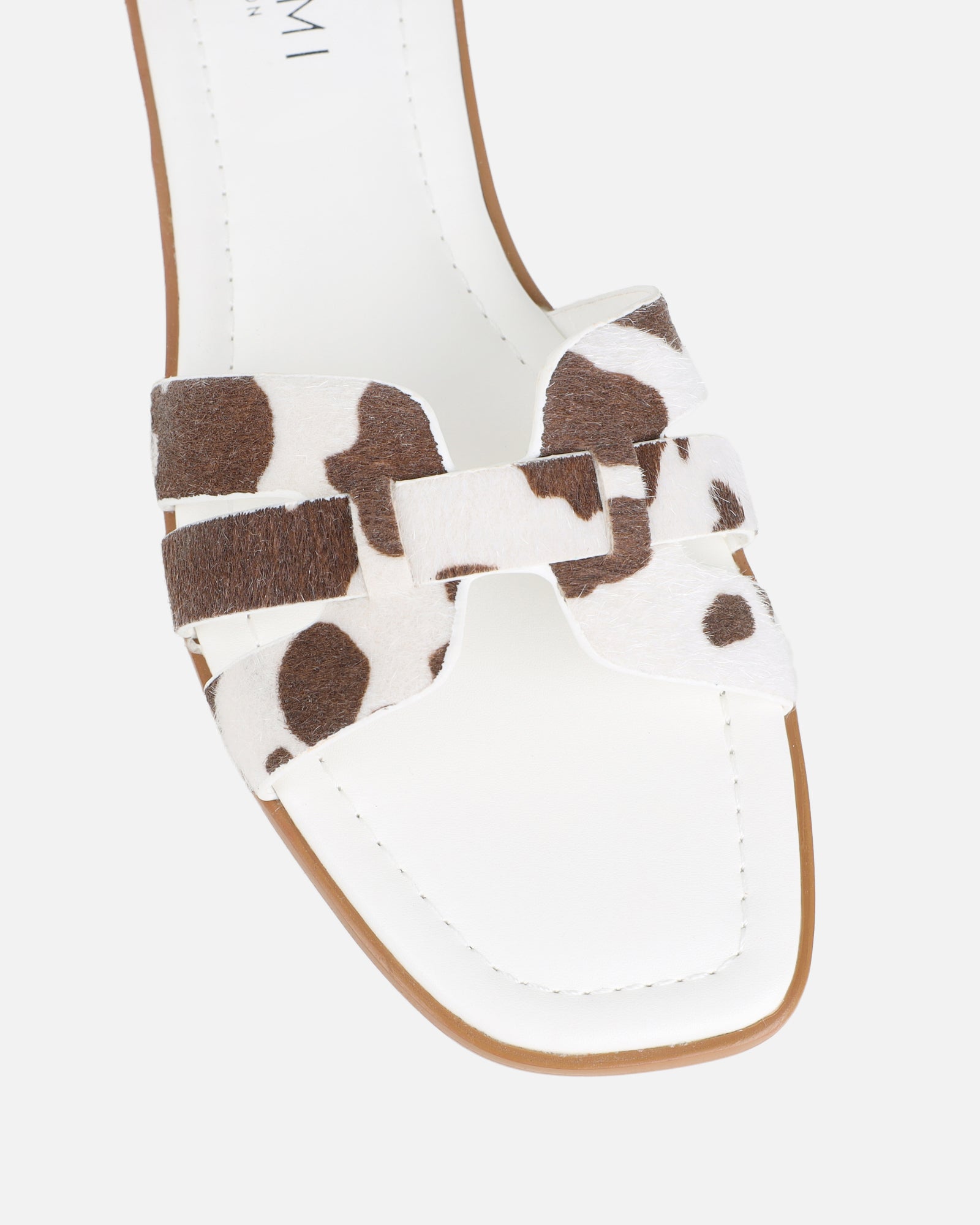 Jorja Cow Print Slip On Flat Sandals